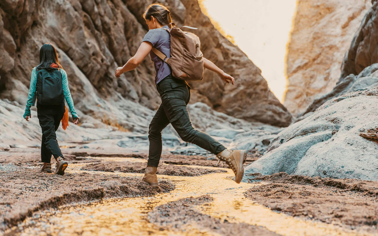 friends hiking through a canyon