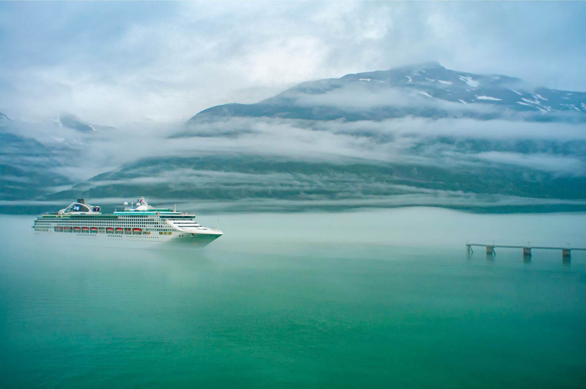 cruise ship emerging out of the fog