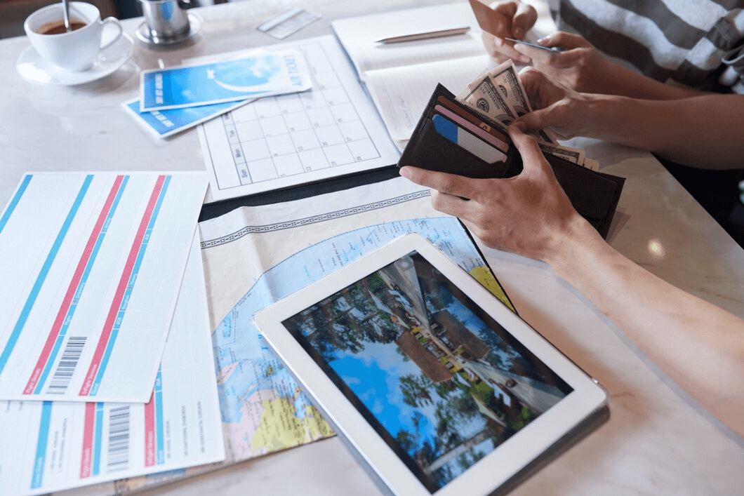 People looking through travel documents 