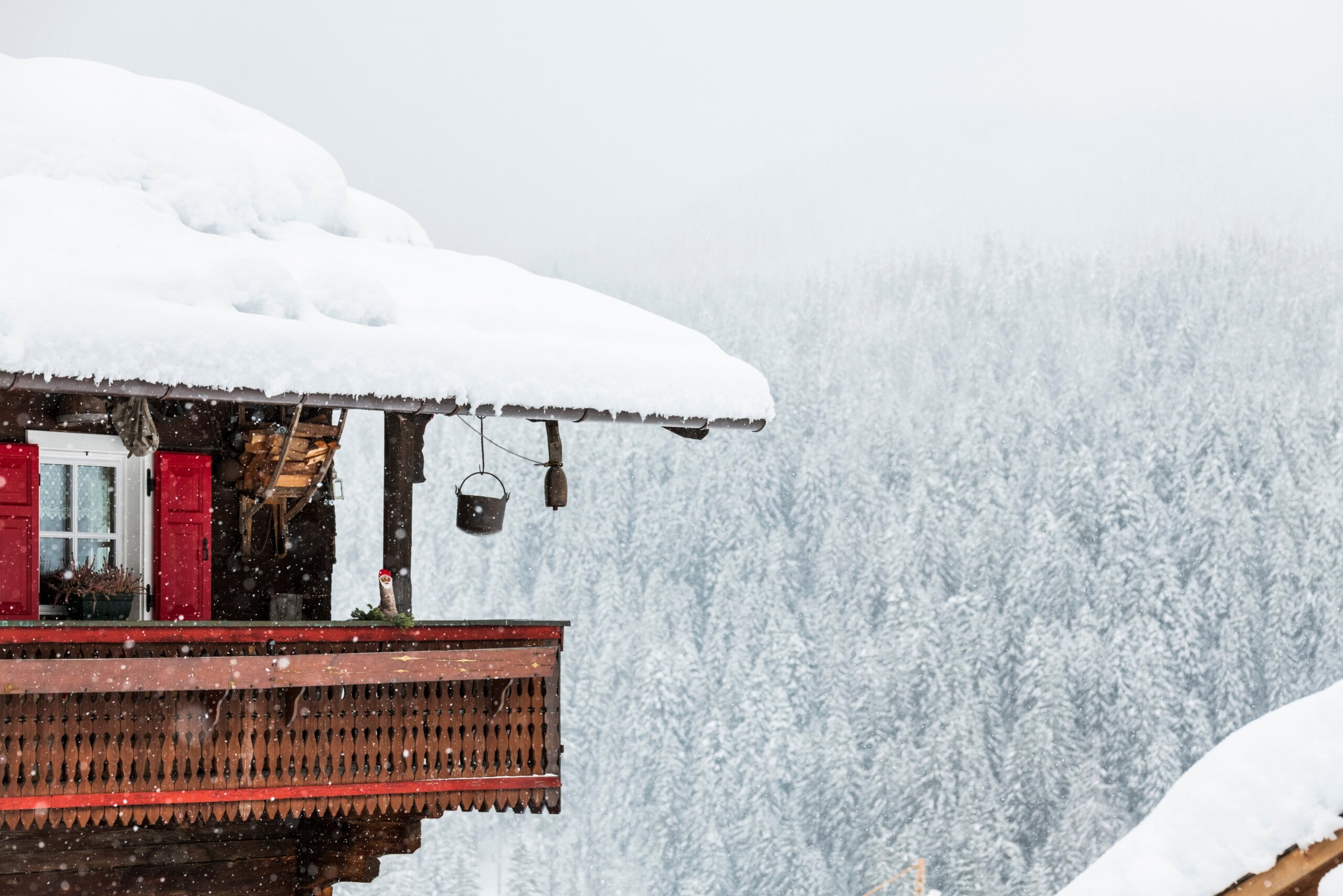 Under a heavy snowfall. Walk in the ancient village of Sappada. Friuli
