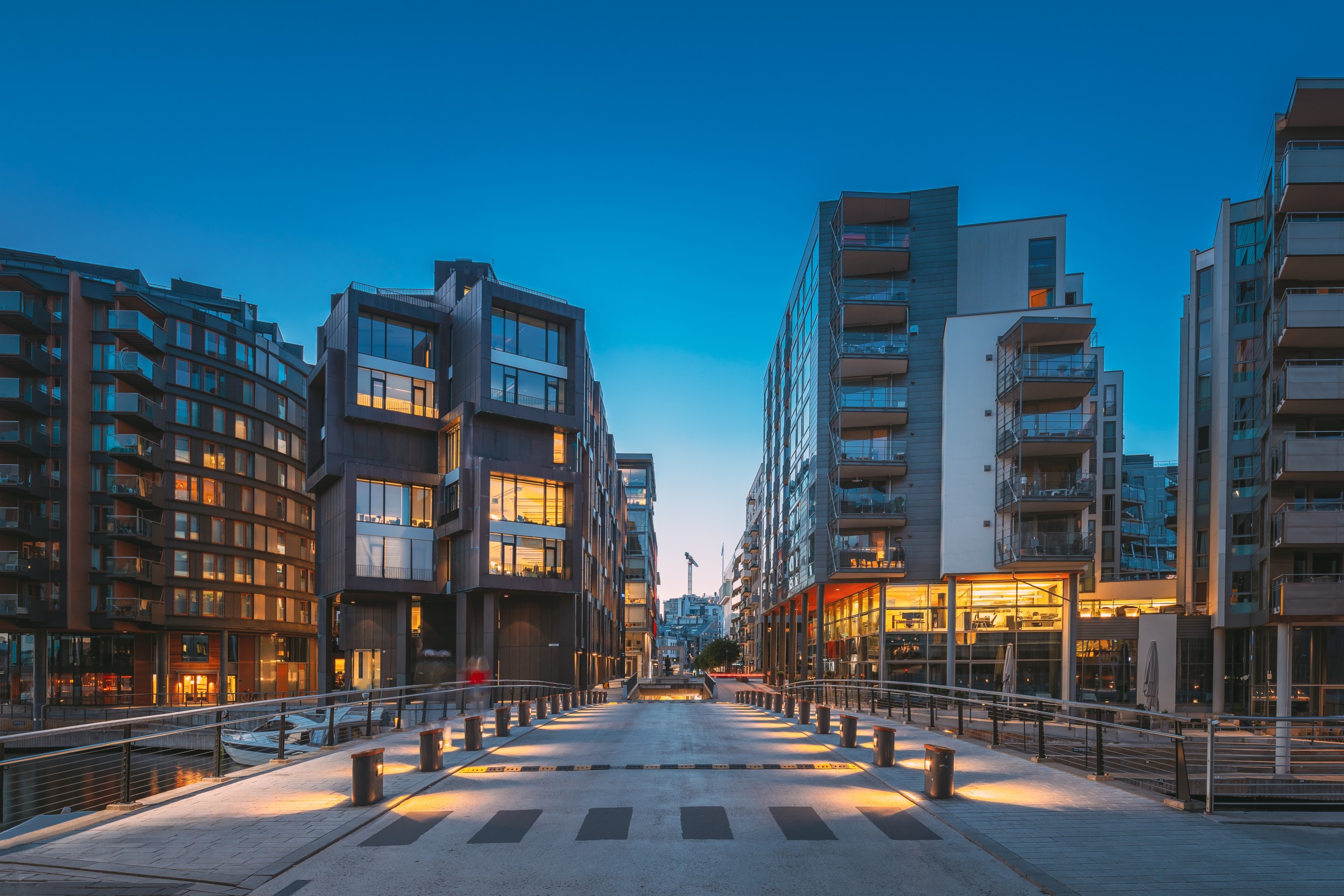 Oslo, Norway. Night View Of Residential Multi-storey Houses In Aker Brygge District. Summer Evening. Residential Area. Famous And Popular Place