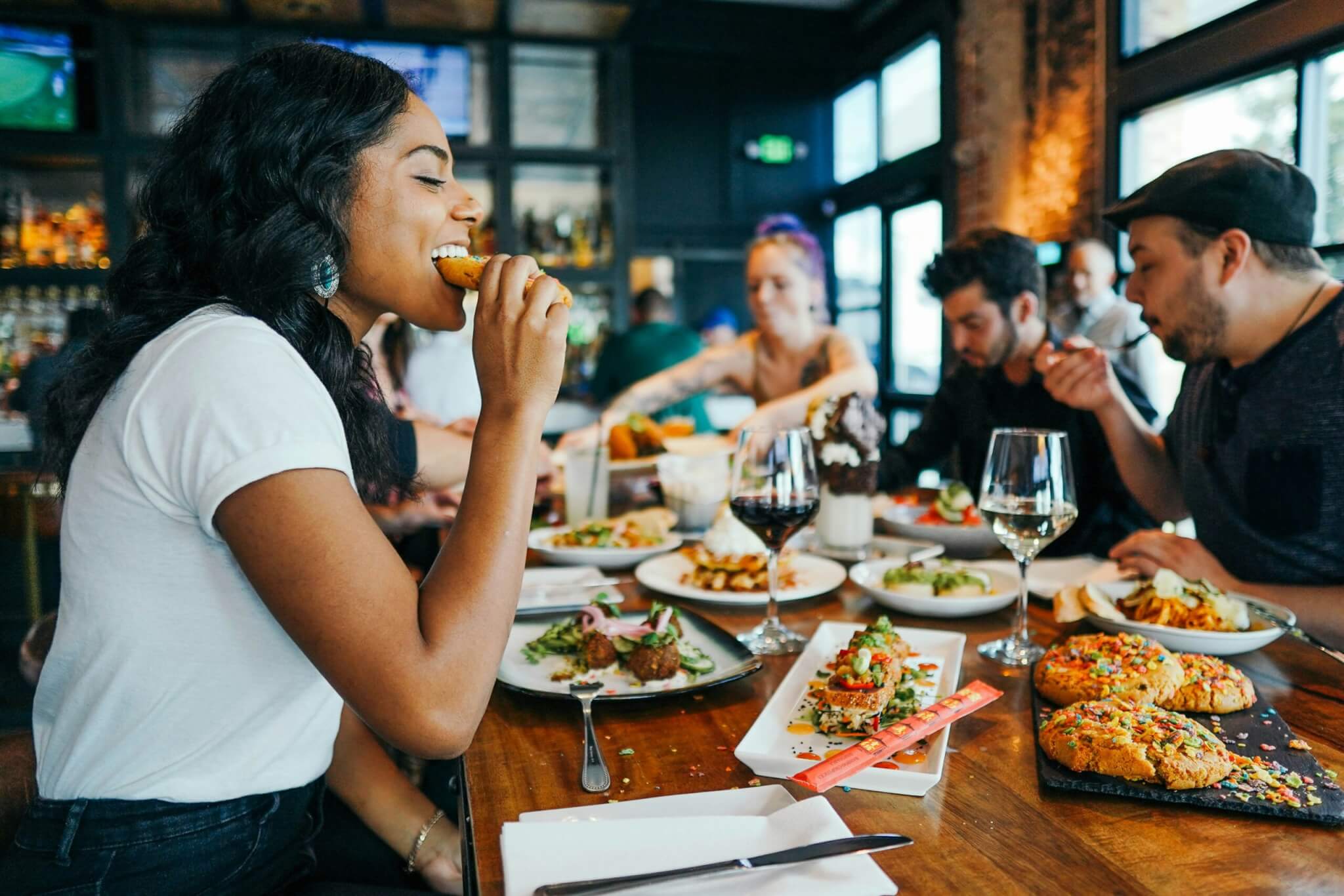 Woman eating bread at a restaurant
