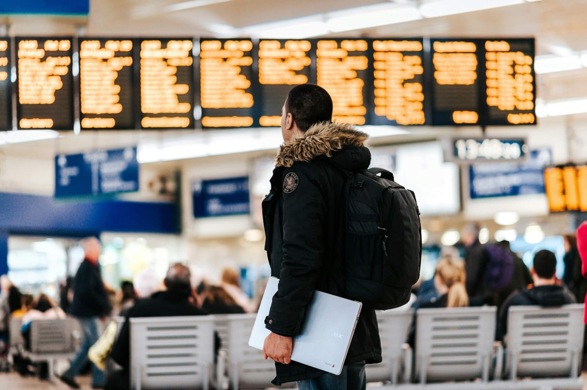 man with backpack in airport