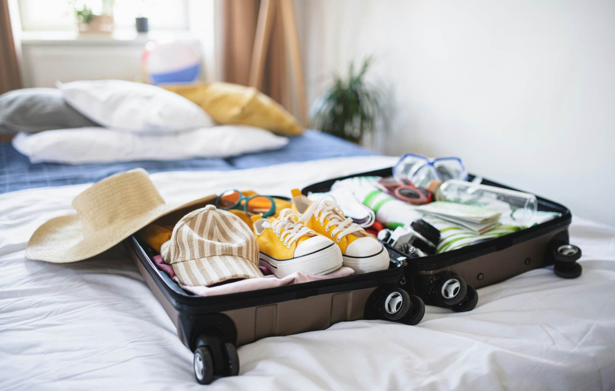 Packed suitcase on a bed