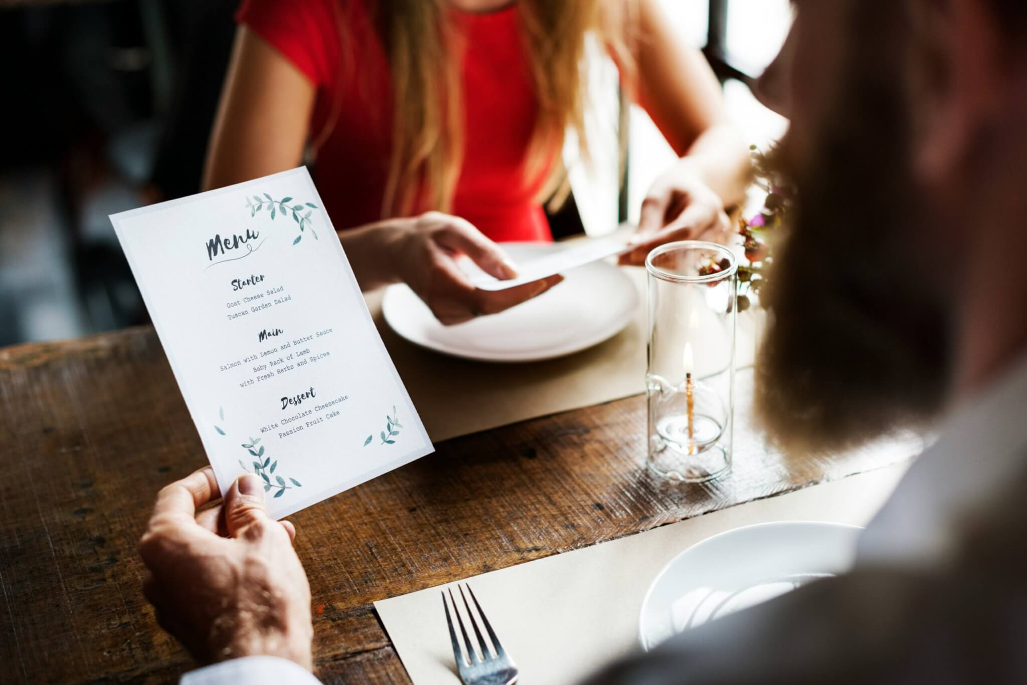 Man looking at a restaurant's menu