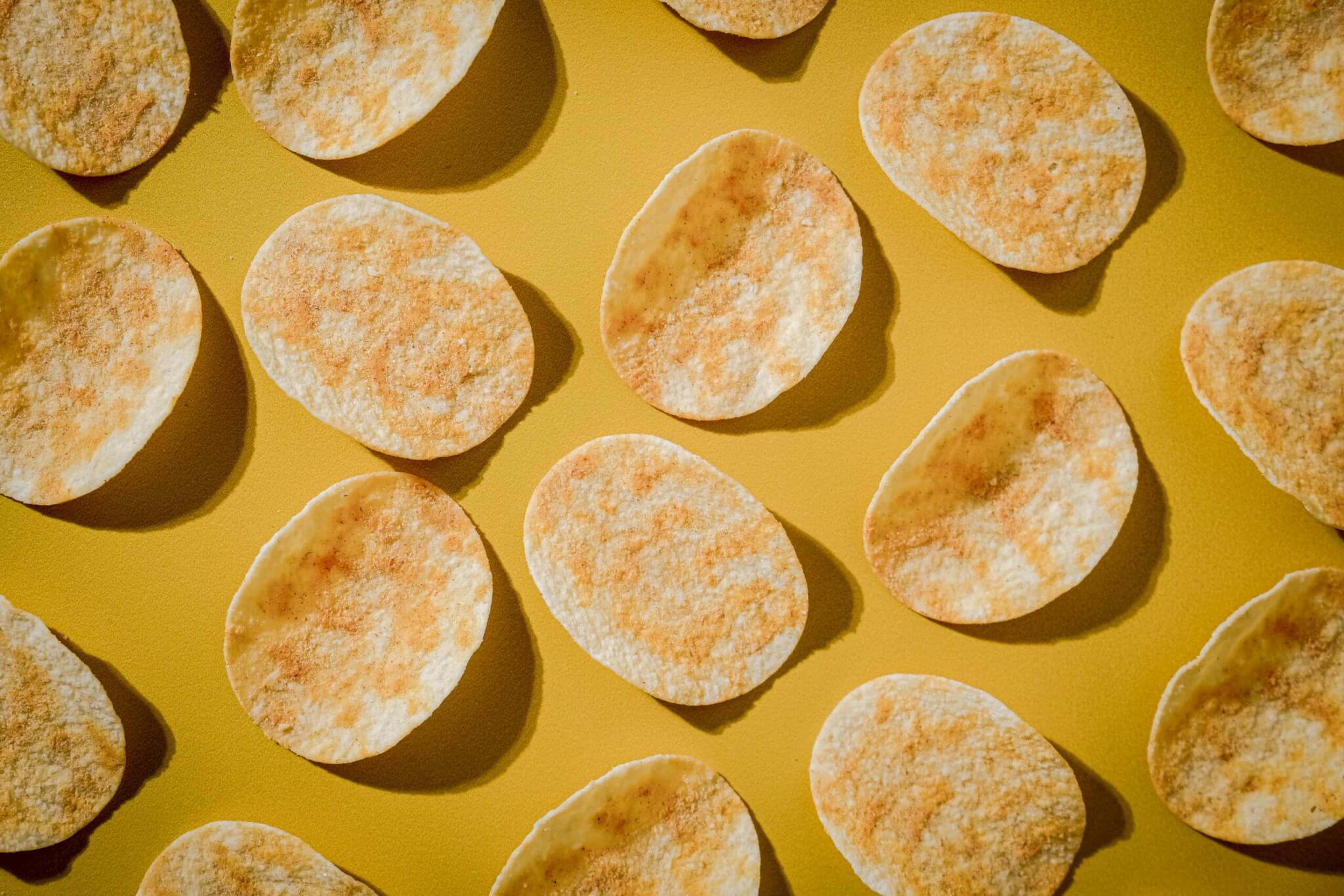 Potato snacks on a yellow background