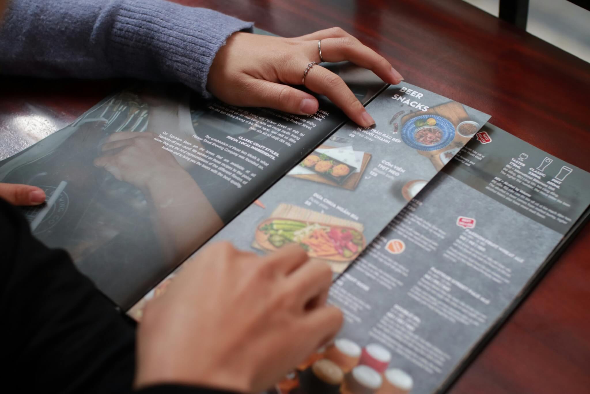 Modern restaurant menu on a wooden table