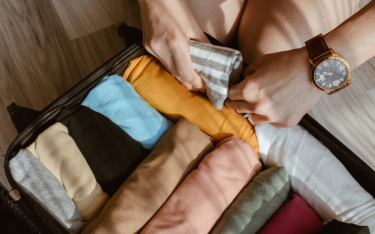 Rolled up clothes in a suitcase