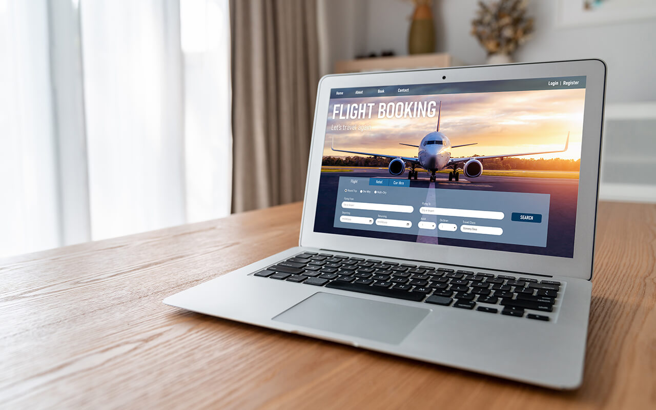 Booking flight on laptop