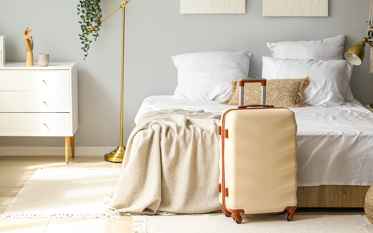 Packed suitcase in a bedroom