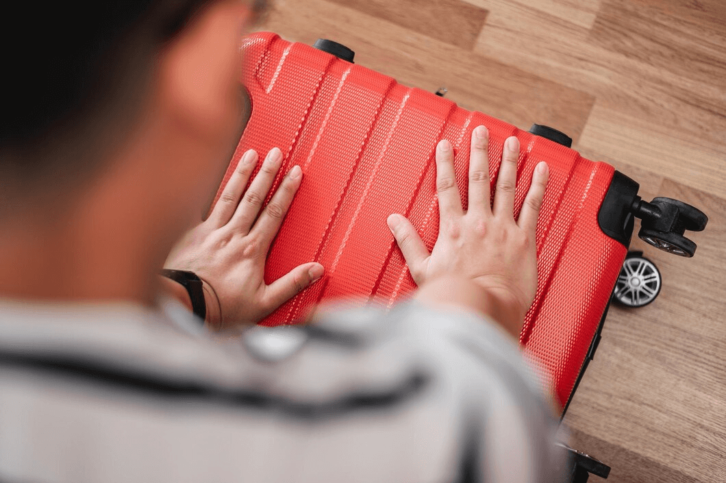 Man packing luggage