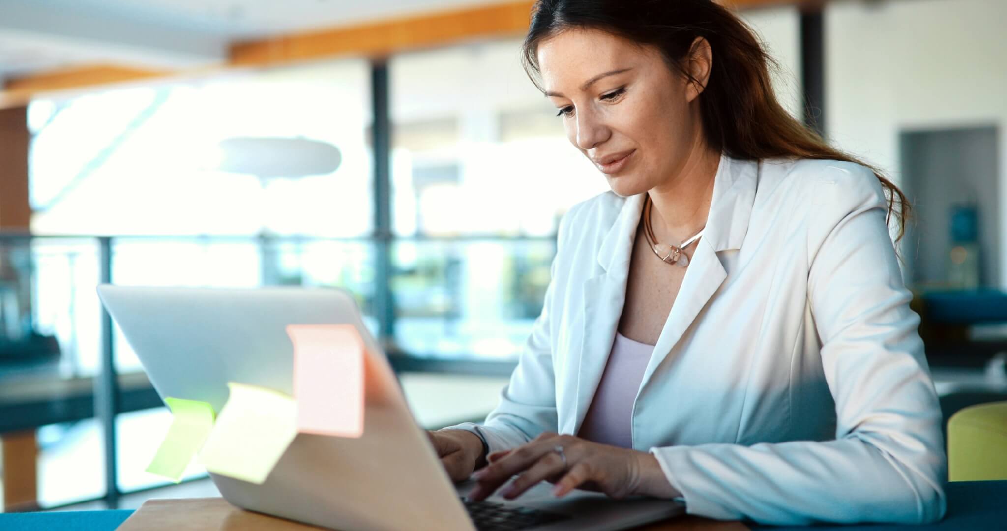 Woman typing on a laptop