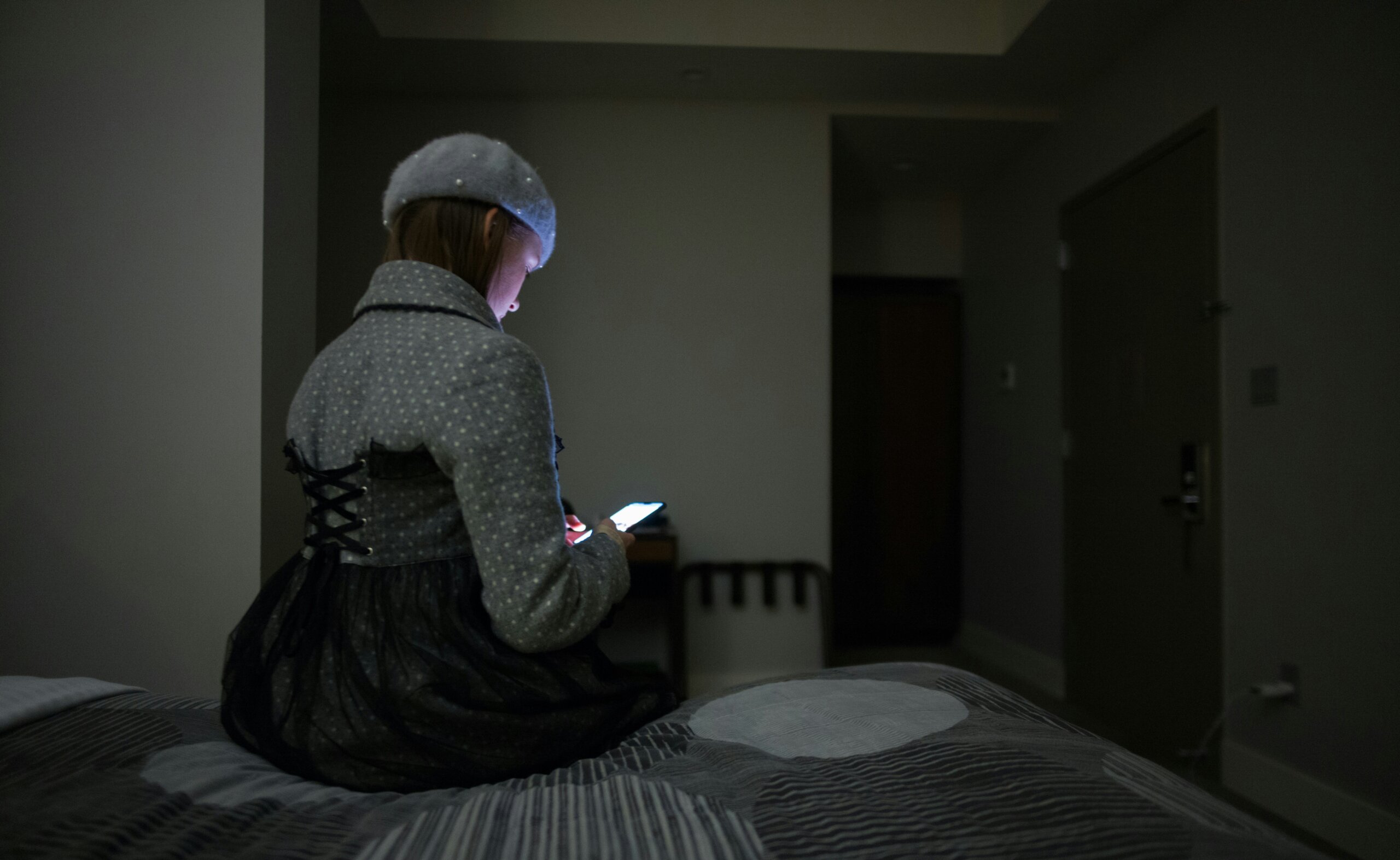 woman on her phone at night