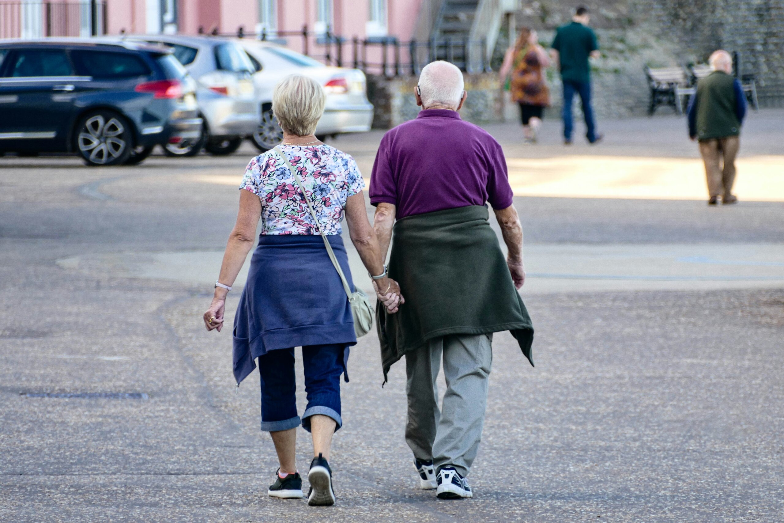 Senior couple walking together during a relaxed travel outing.