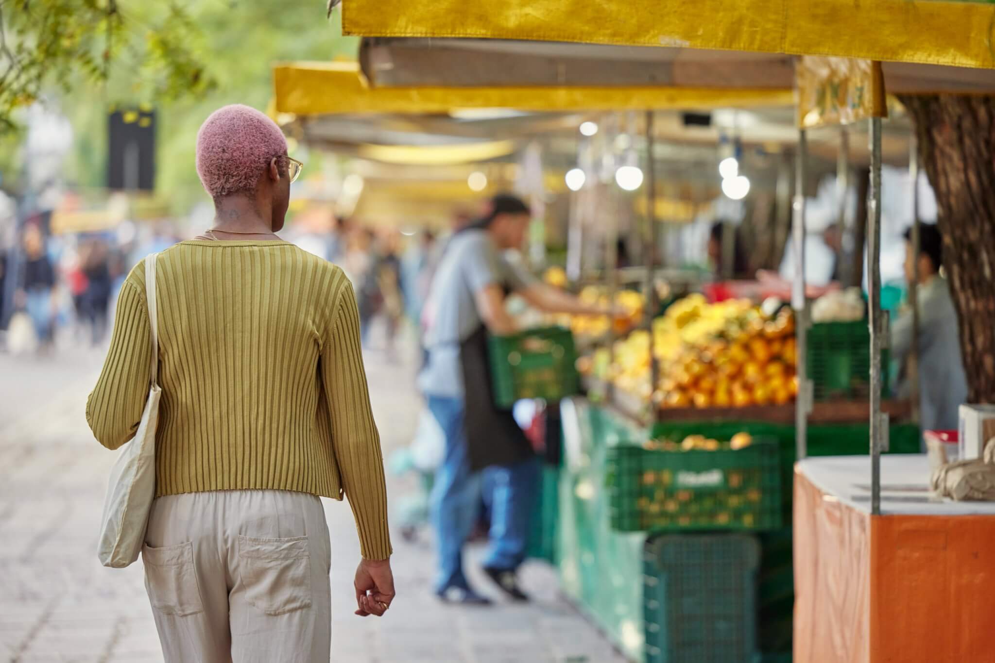 Person walking through food market
