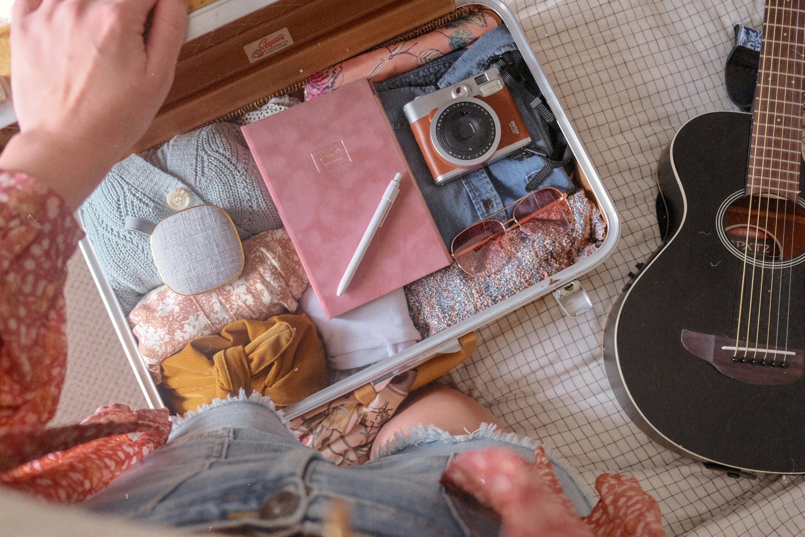 woman packing a suitcase