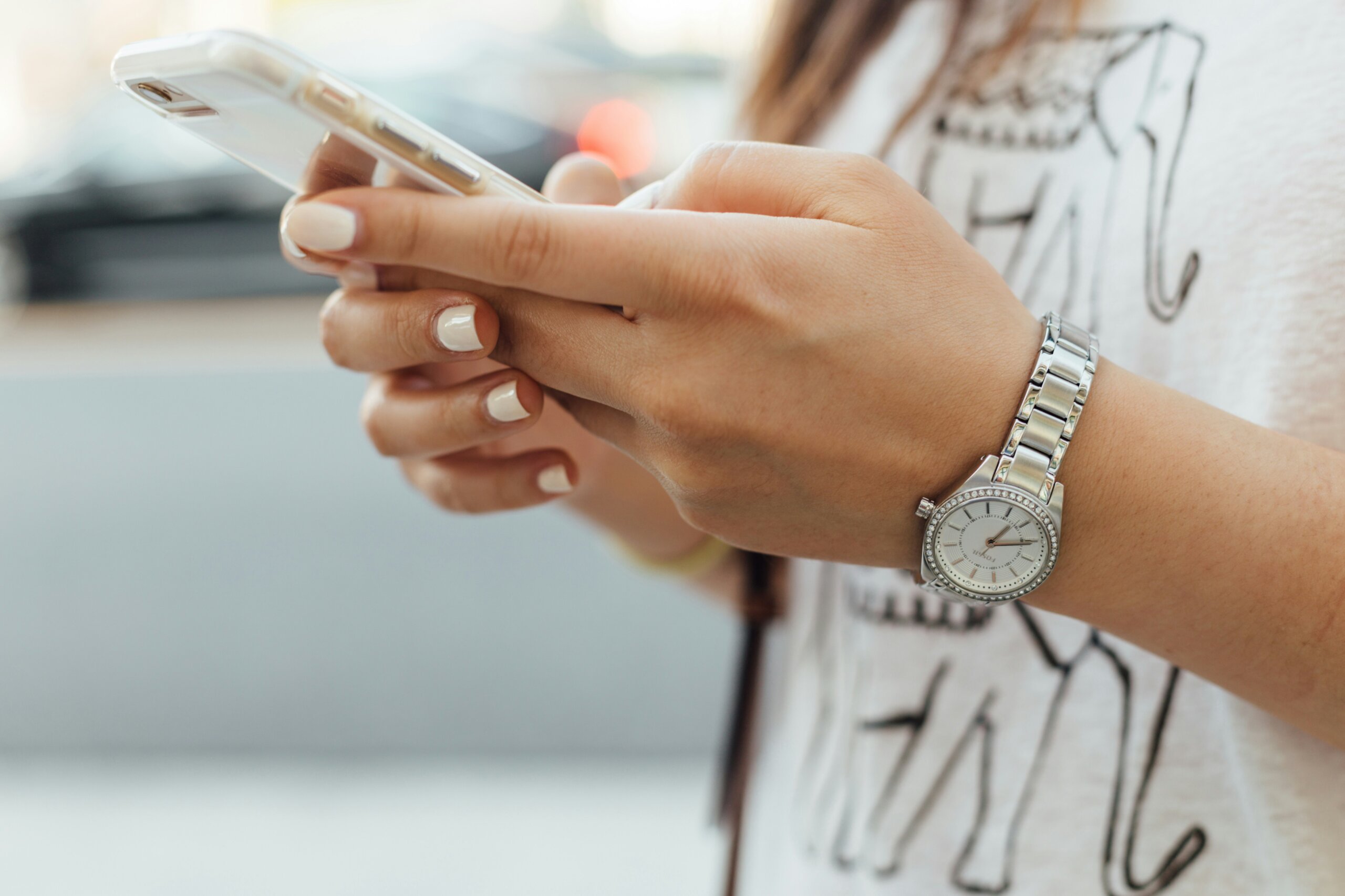 Woman typing on a smartphone
