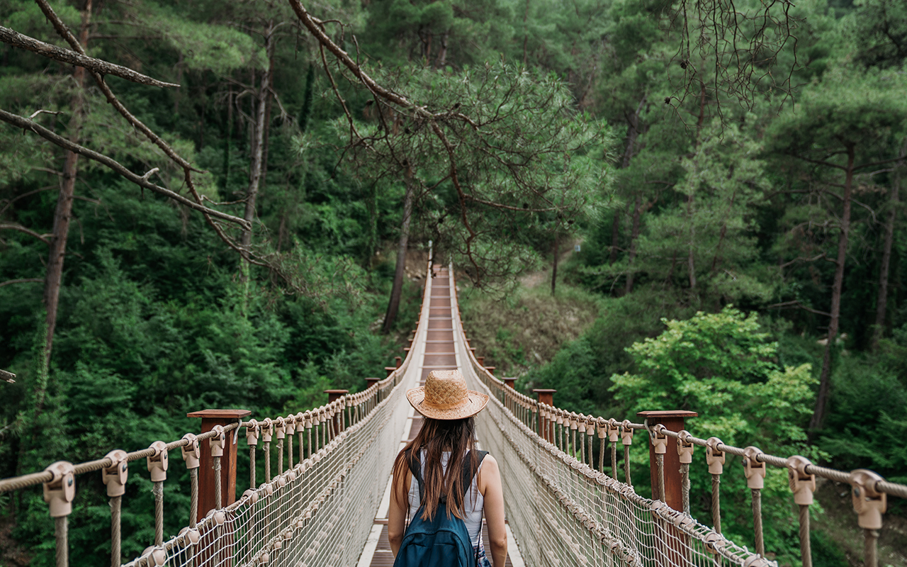 Woman on rope bridge
