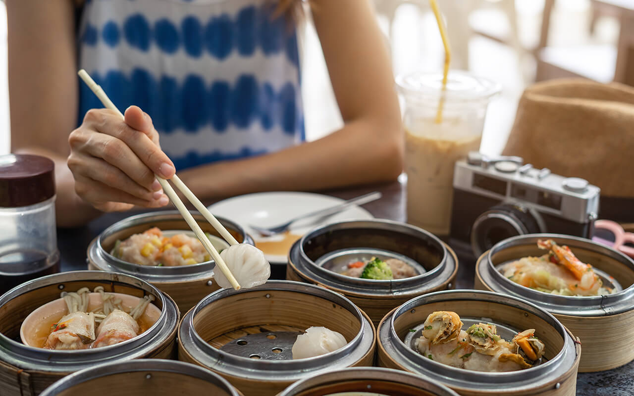 Woman eating Asian food
