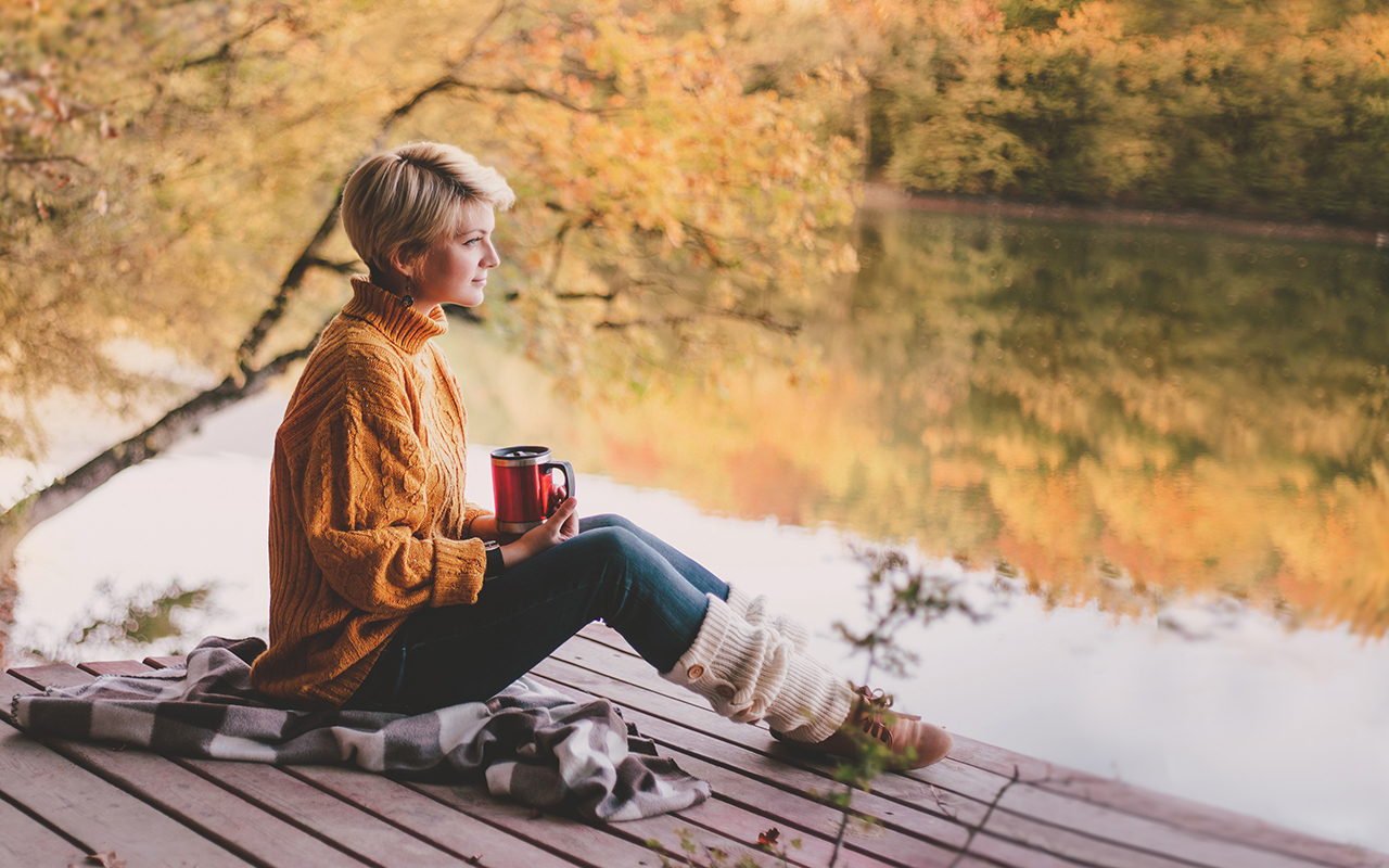 Woman with short hair lounging outside