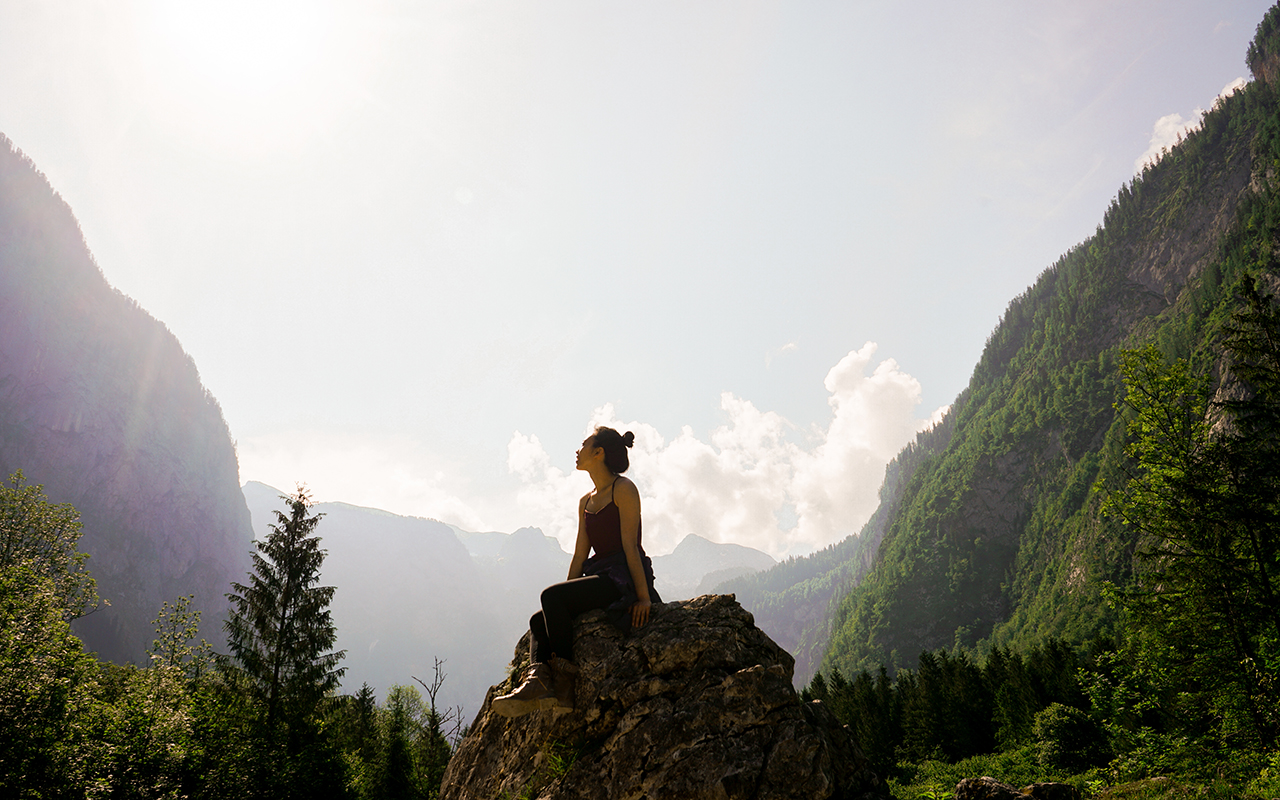 Woman on Top of Rock
