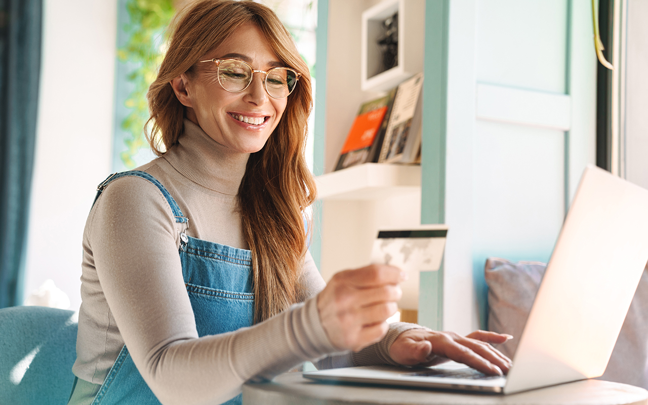 Woman using a credit card online