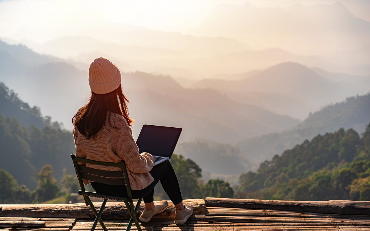 Woman on a laptop outdoors