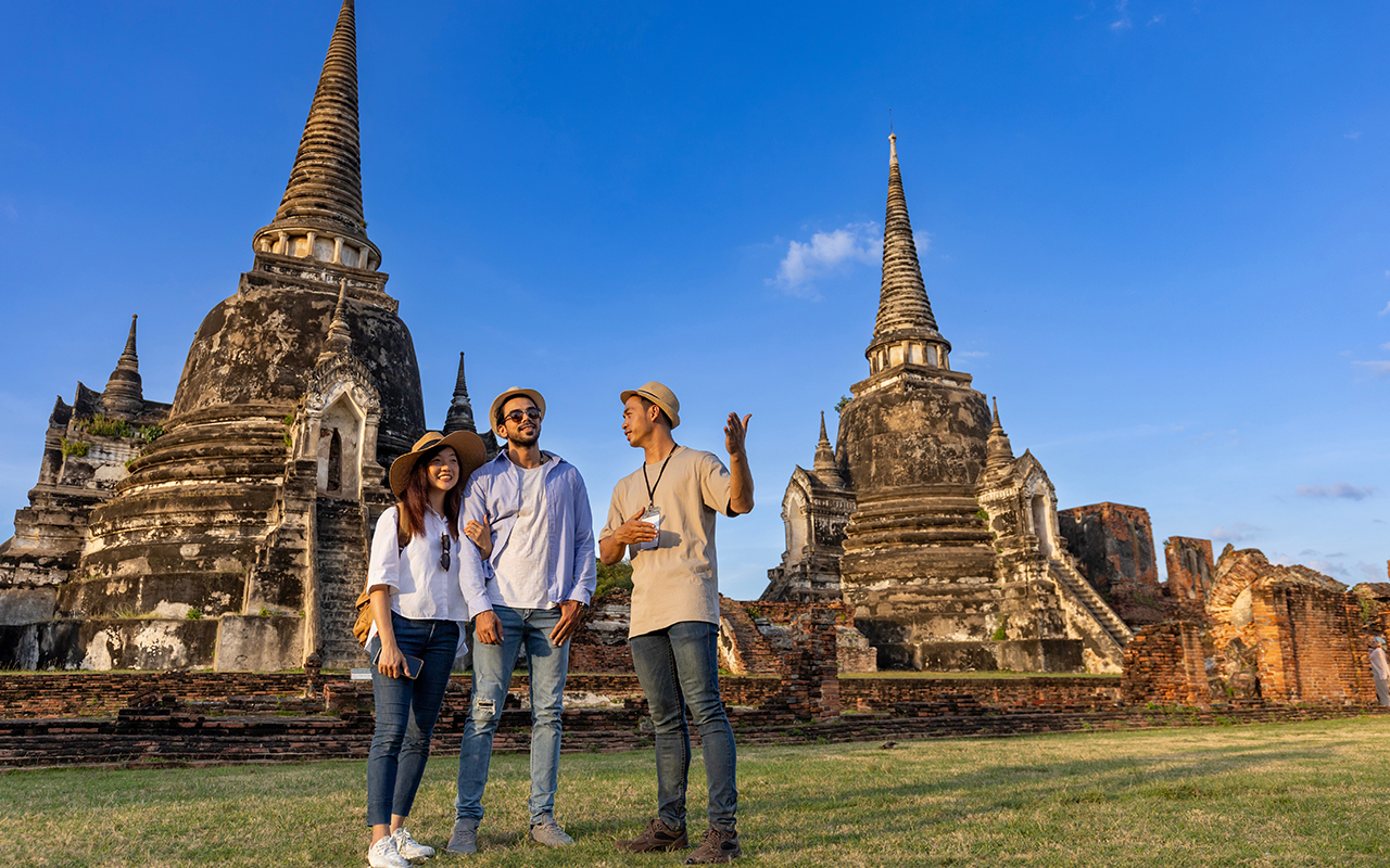 group of tourists at a temple in asia 