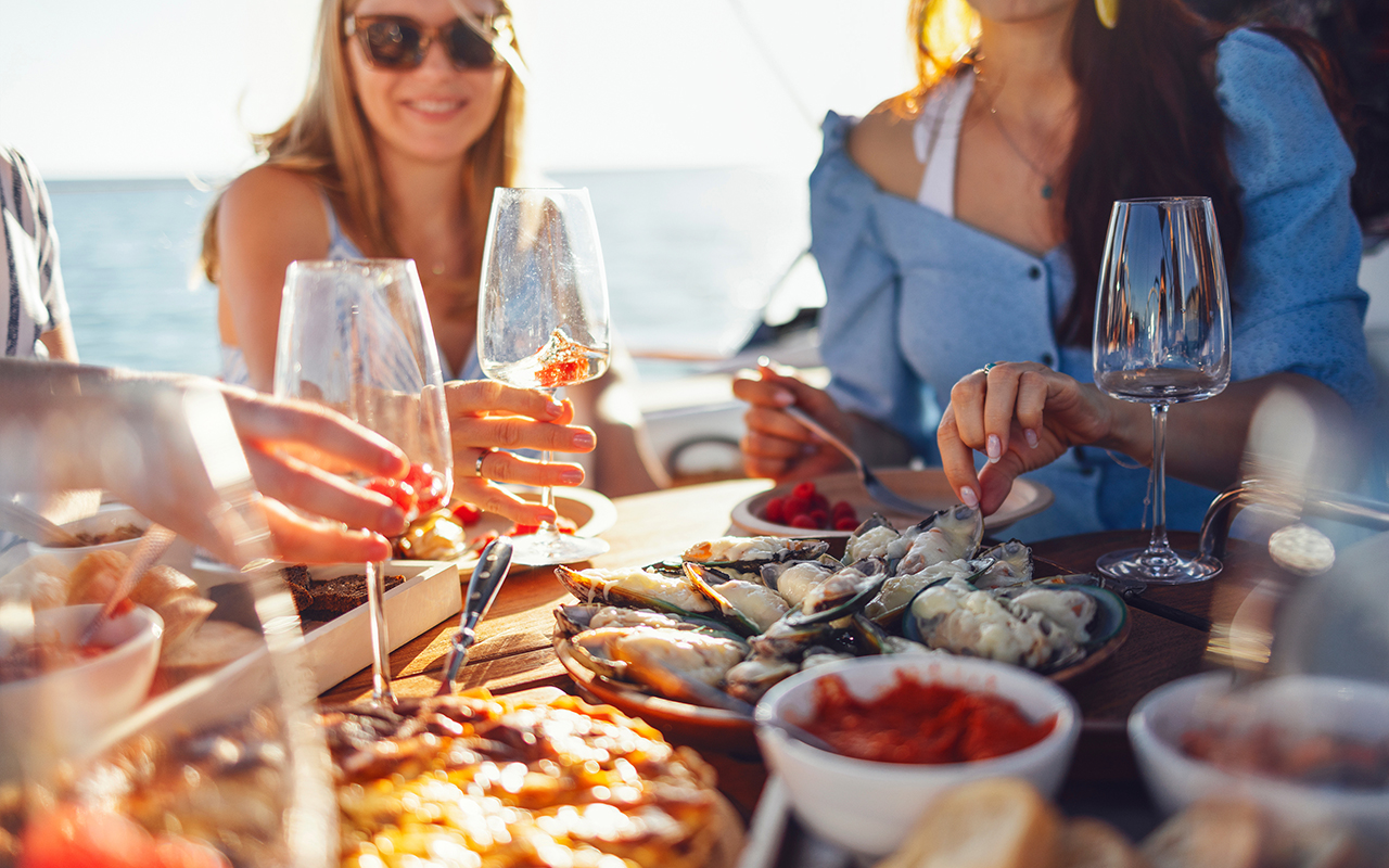 Group of people eating on a cruise