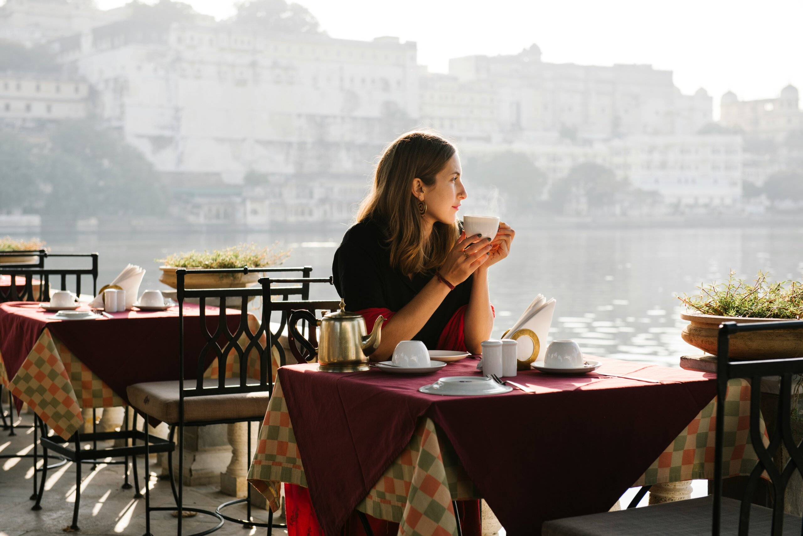 Woman drinking coffee at a restaurant 