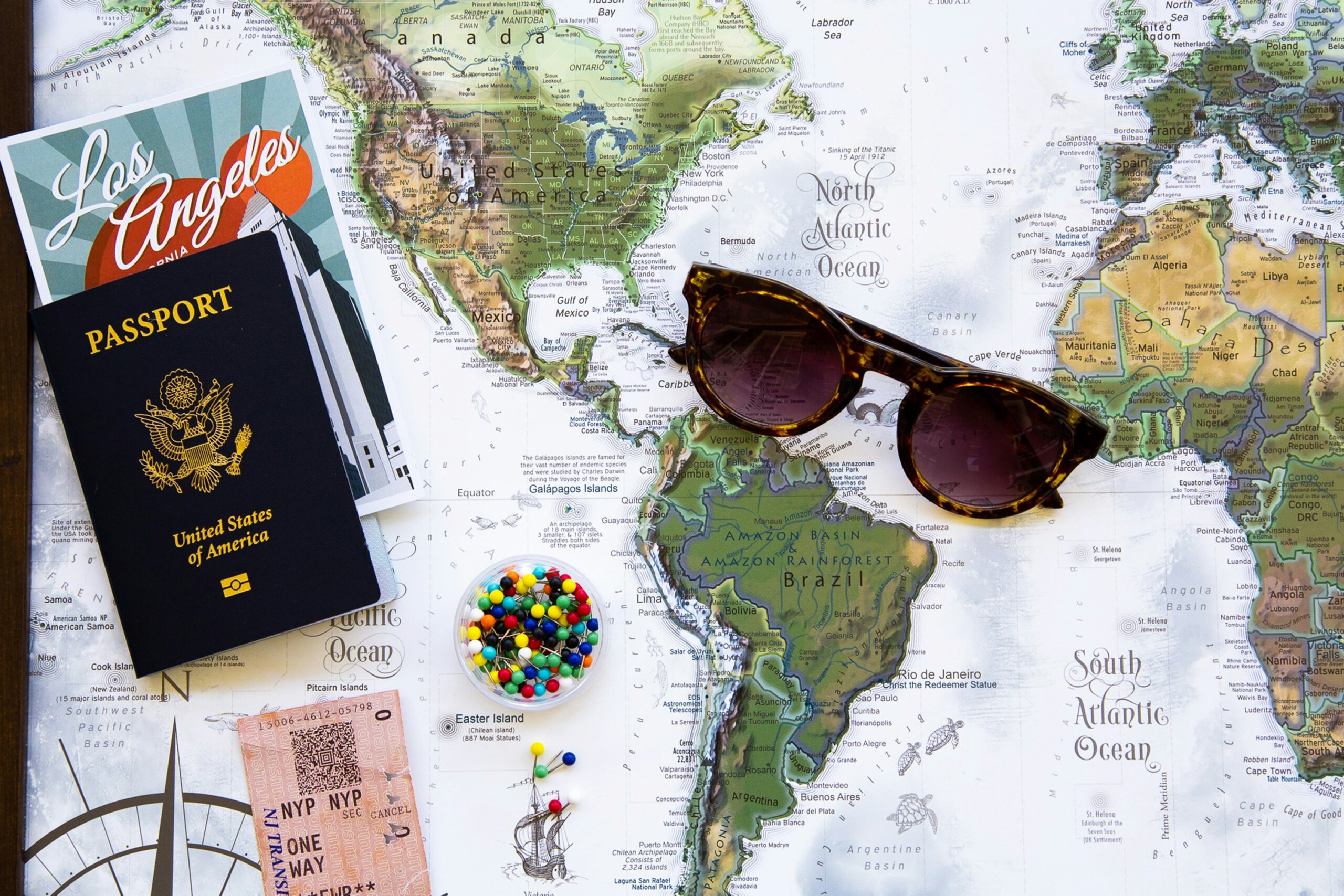 Glasses and passport on a map
