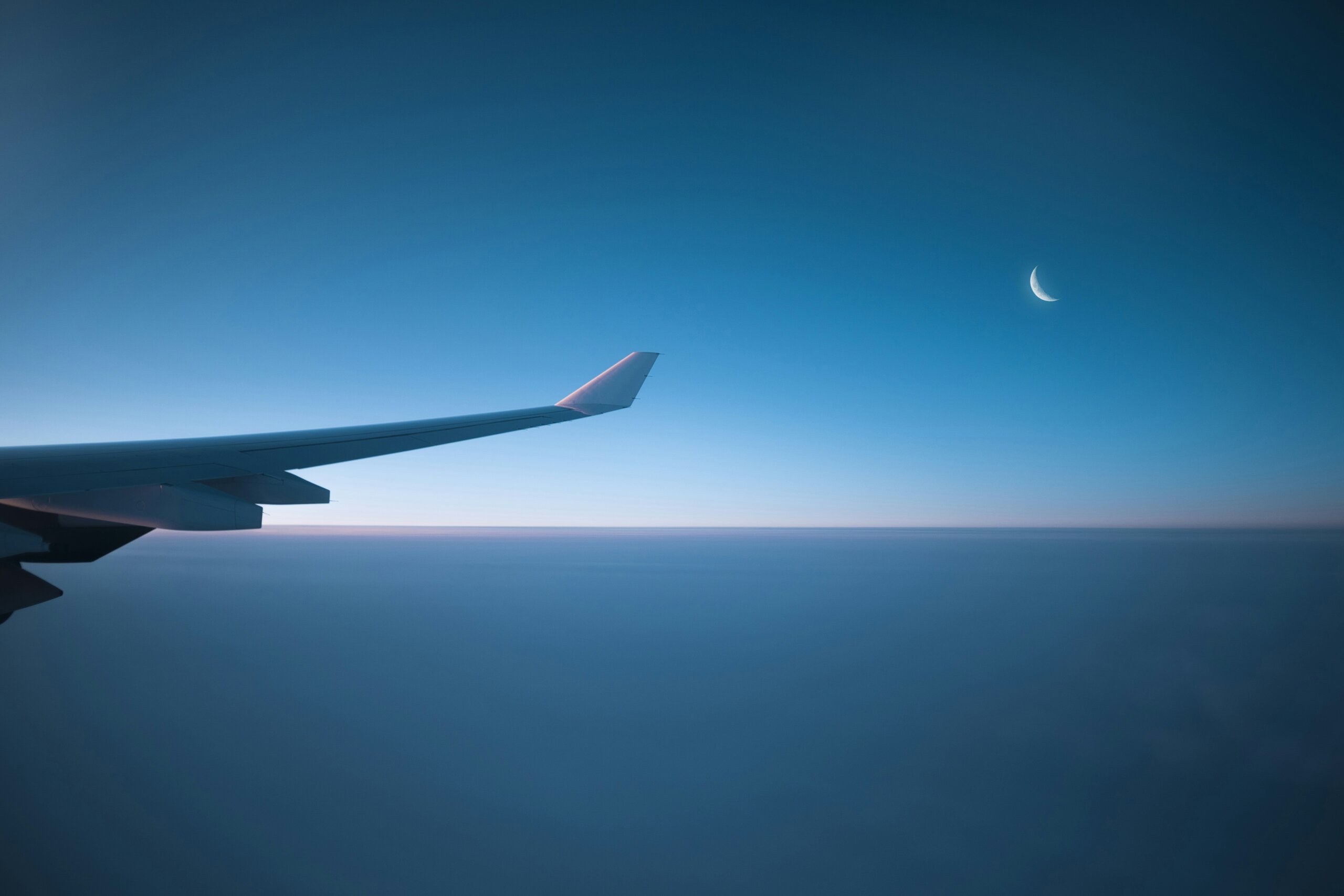 airplane wing and moon