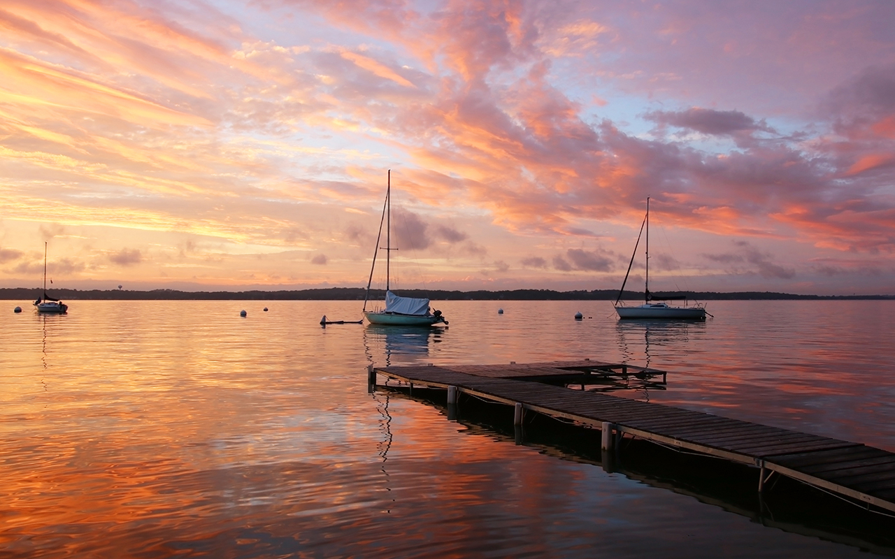 Bright sky reflects in the lake water. Madison, WI.