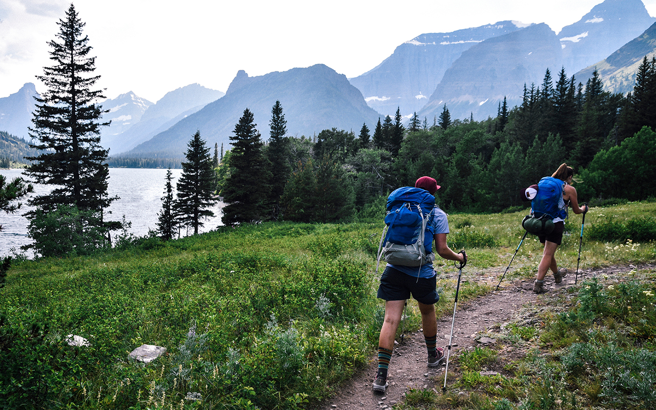 Women Backpacking in Glacier National Park in Montana During Summer