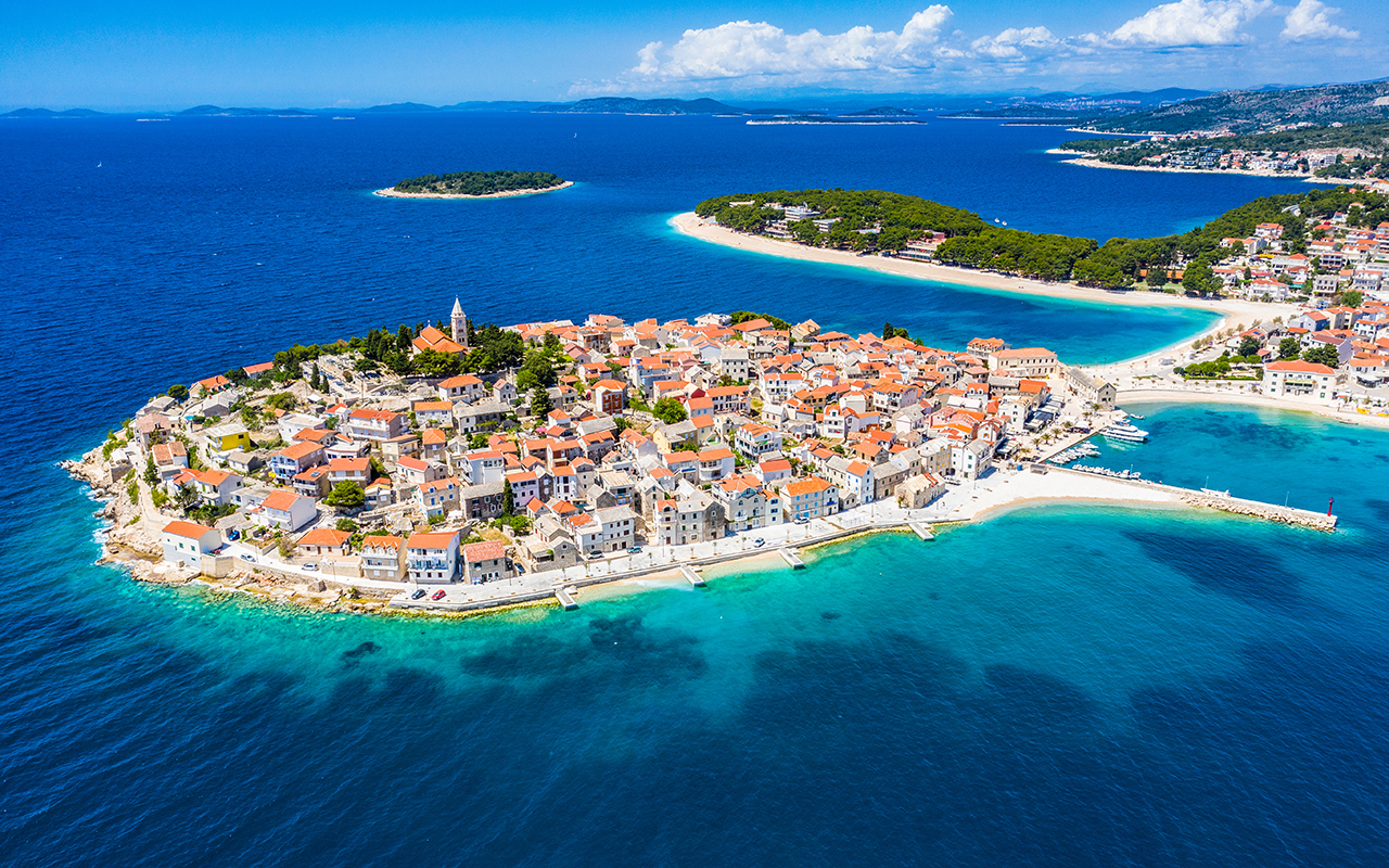 Aerial view of Primosten old town, amazing sunny landscape, Dalmatia, Croatia. Famous tourist resort on Adriatic sea coast.