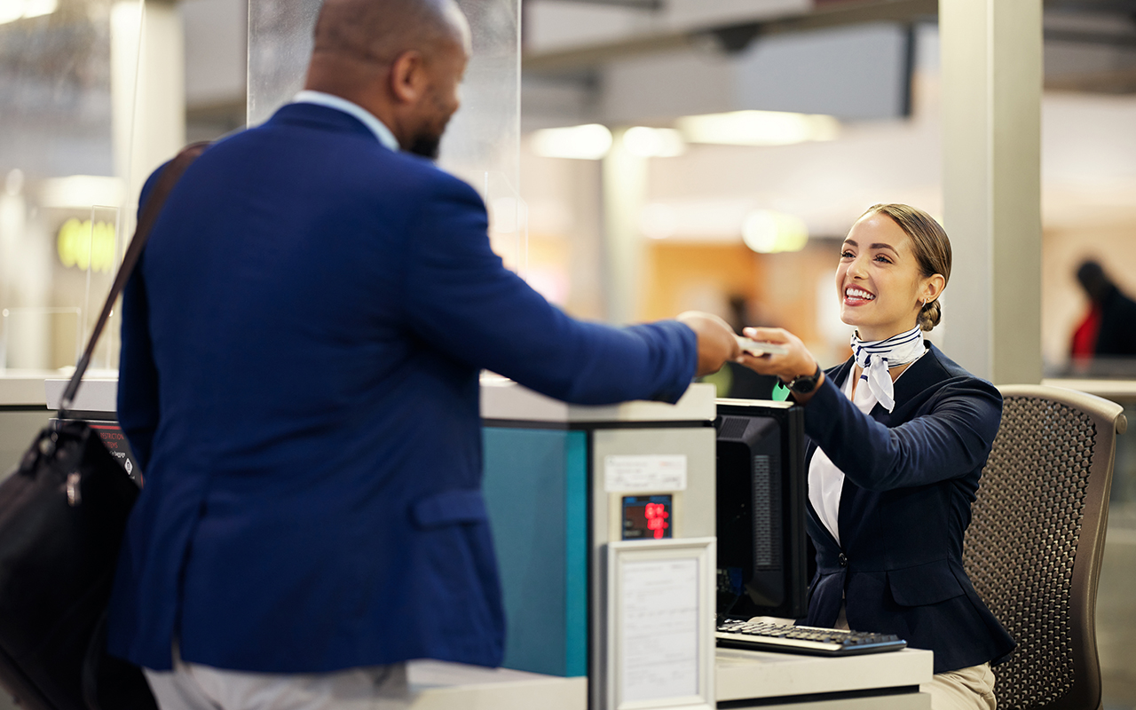 Flight attendant at airline counter