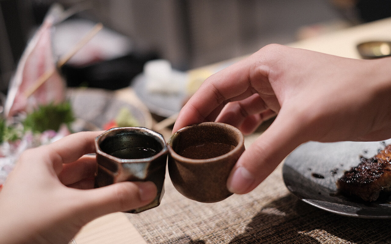 Sake Cheering Celebration Night Life Japanese traditional alcoholic drink, sake in a restaurant