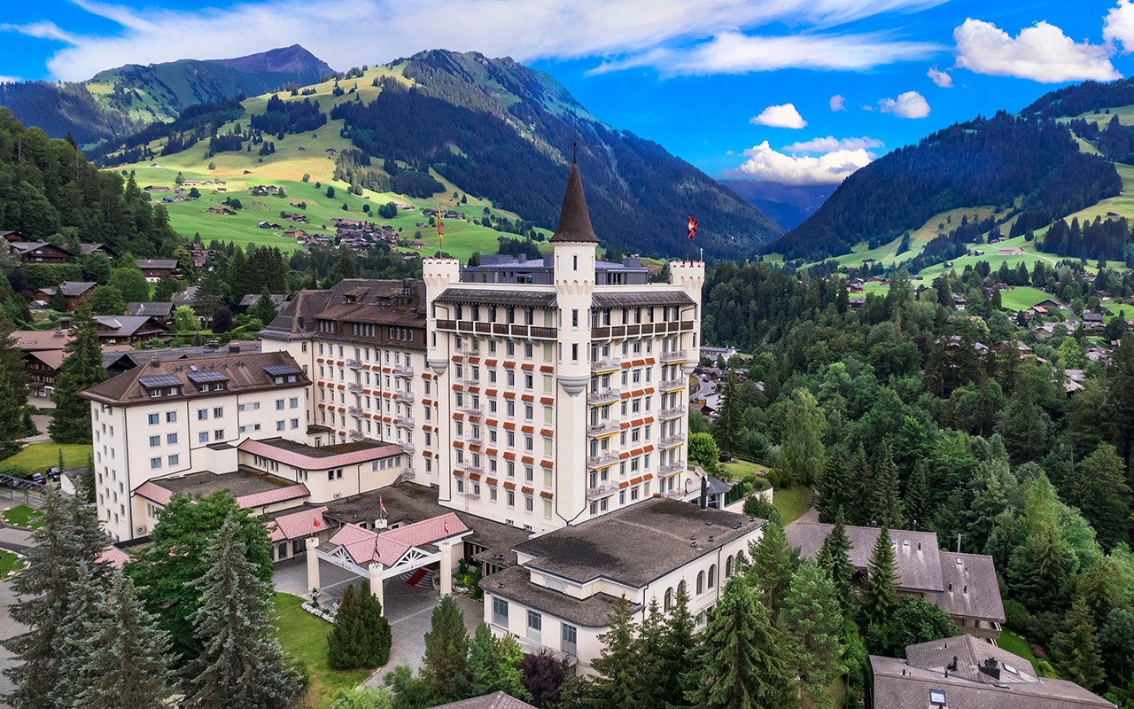 Gstaad - elegant and popular mountain ski resort in Swizerland, canton Bern. aerial drone panoramic view