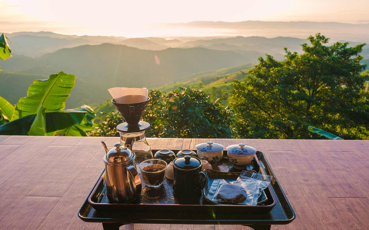 drip coffee in the morning with a look at the mountains of Doi Chang Chiang Rai Thailand