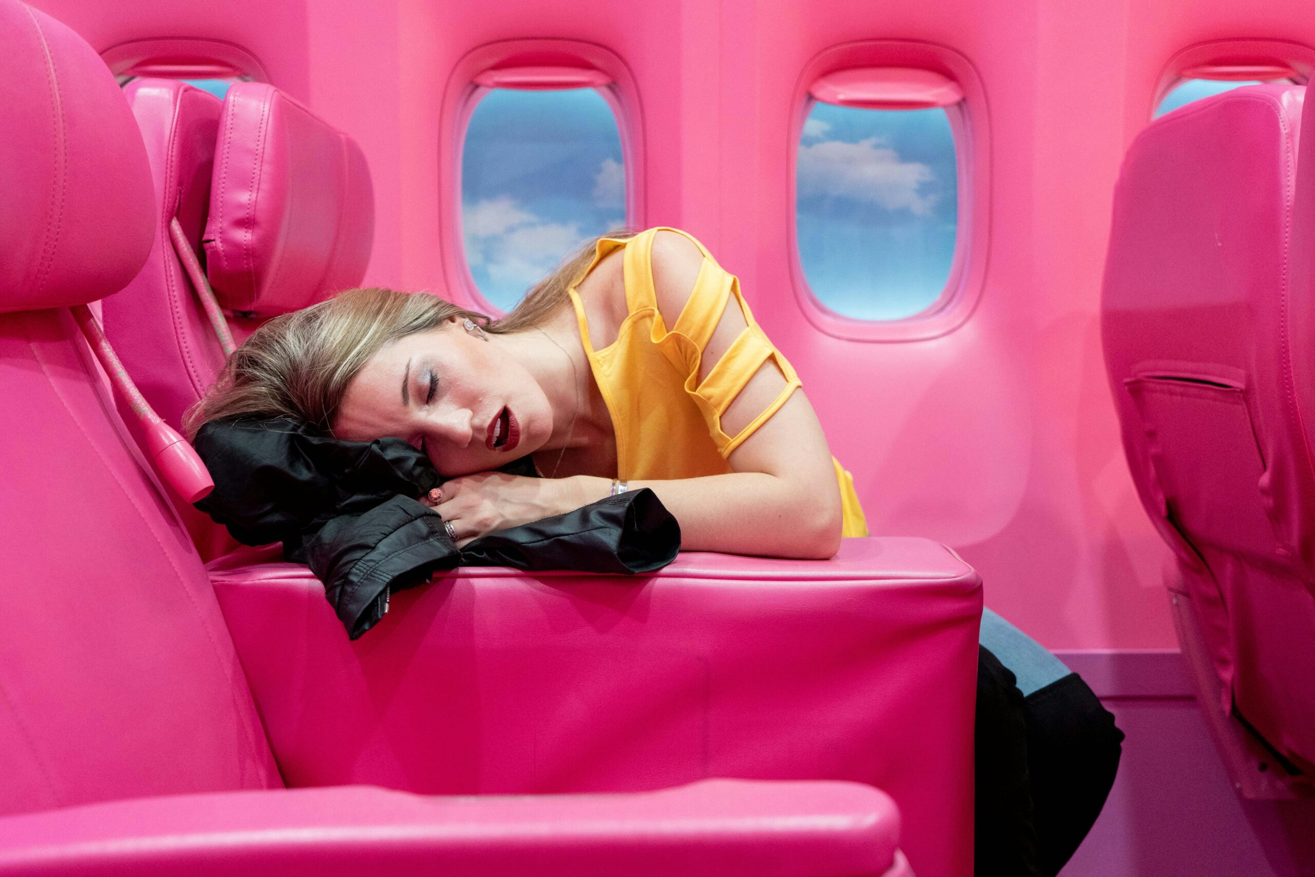 woman sleeping on airplane