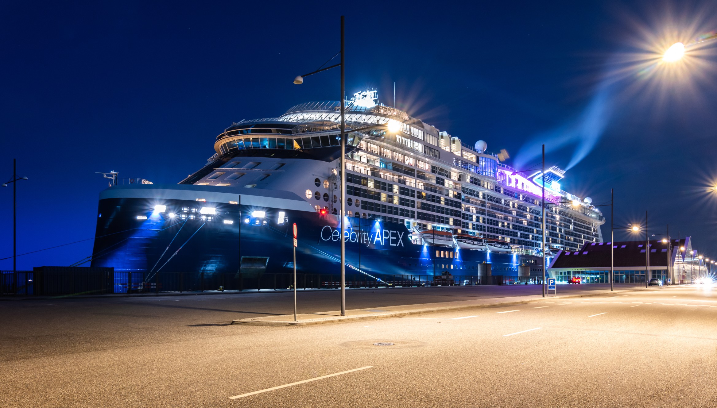 Copenhagen, Denmark - July 28, 2023: Celebrity Cruises ship Apex docked in port of Copenhagen, Denmark at night.
