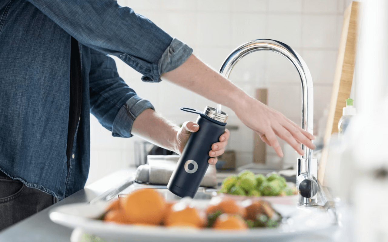Person refilling a water bottle