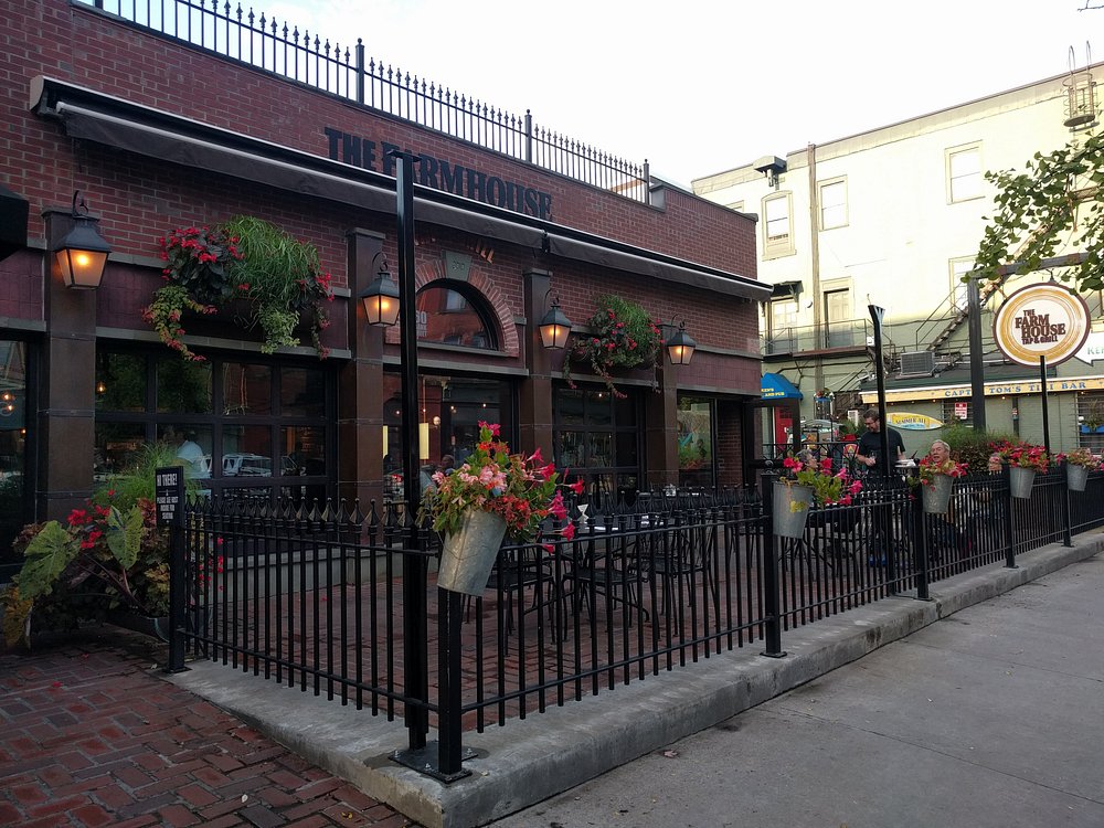Street view of folk enjoying a meal at The Farmhouse Tap & Grill
 in Burlington Vermont