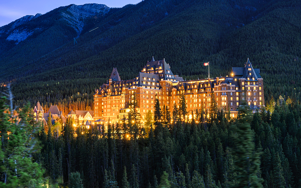 Fairmont banff springs luxury hotel with illumination in the canadian rockies at Banff national park