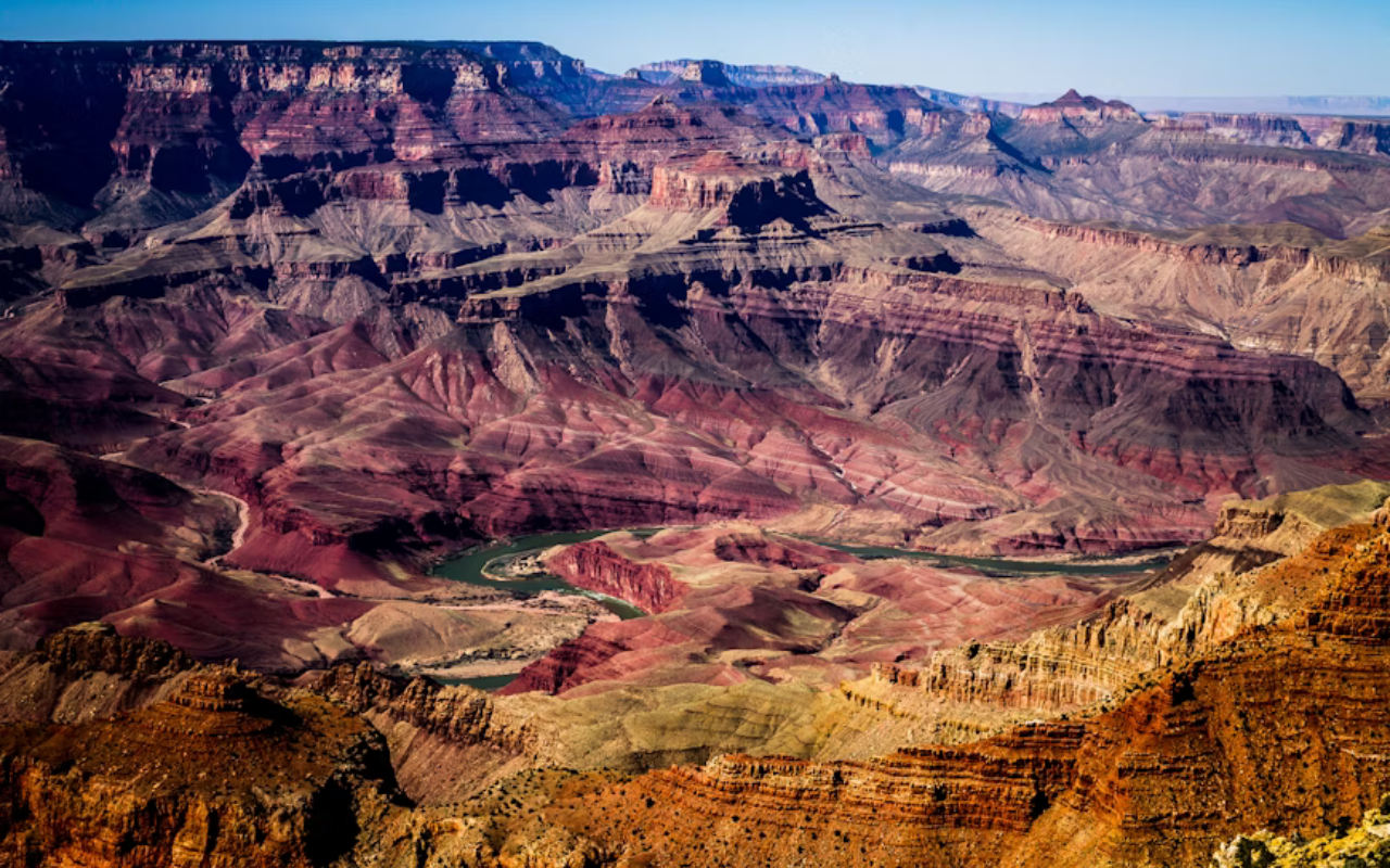 A river winds throughout the valley of Grand Canyon National Park.
