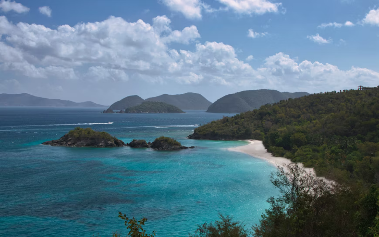 Crystal-clear blue water surrounds the small tropical islands and white sand beaches of St. John.