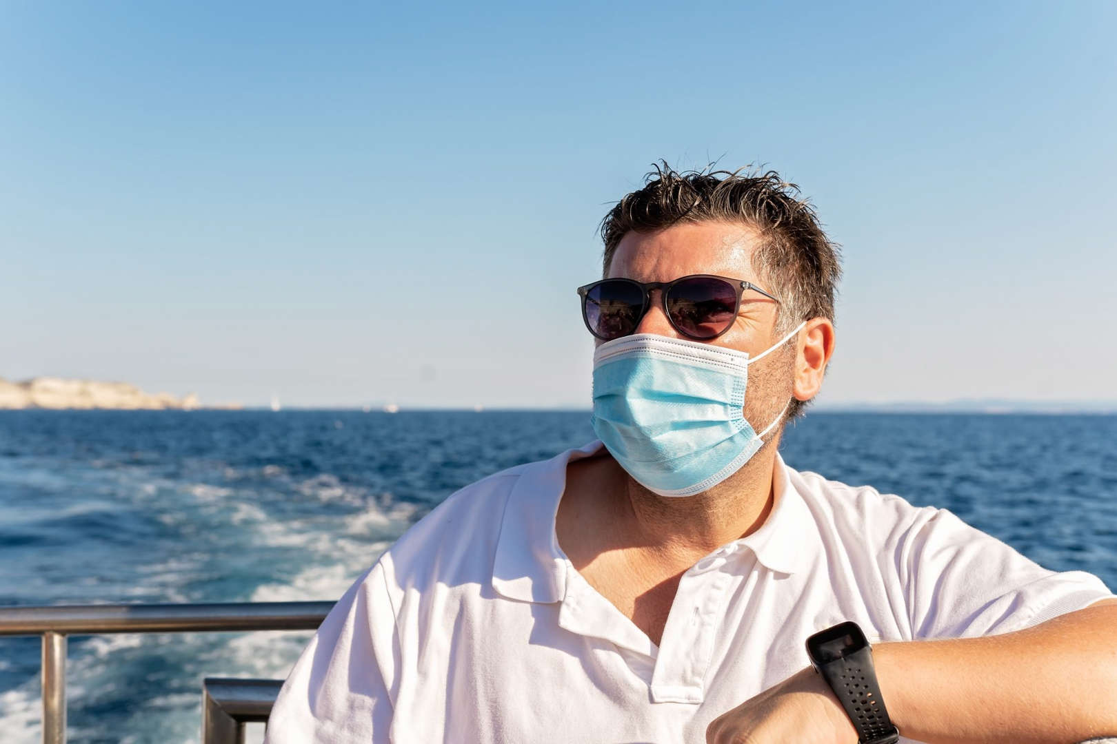 Man wearing a mask on a ship