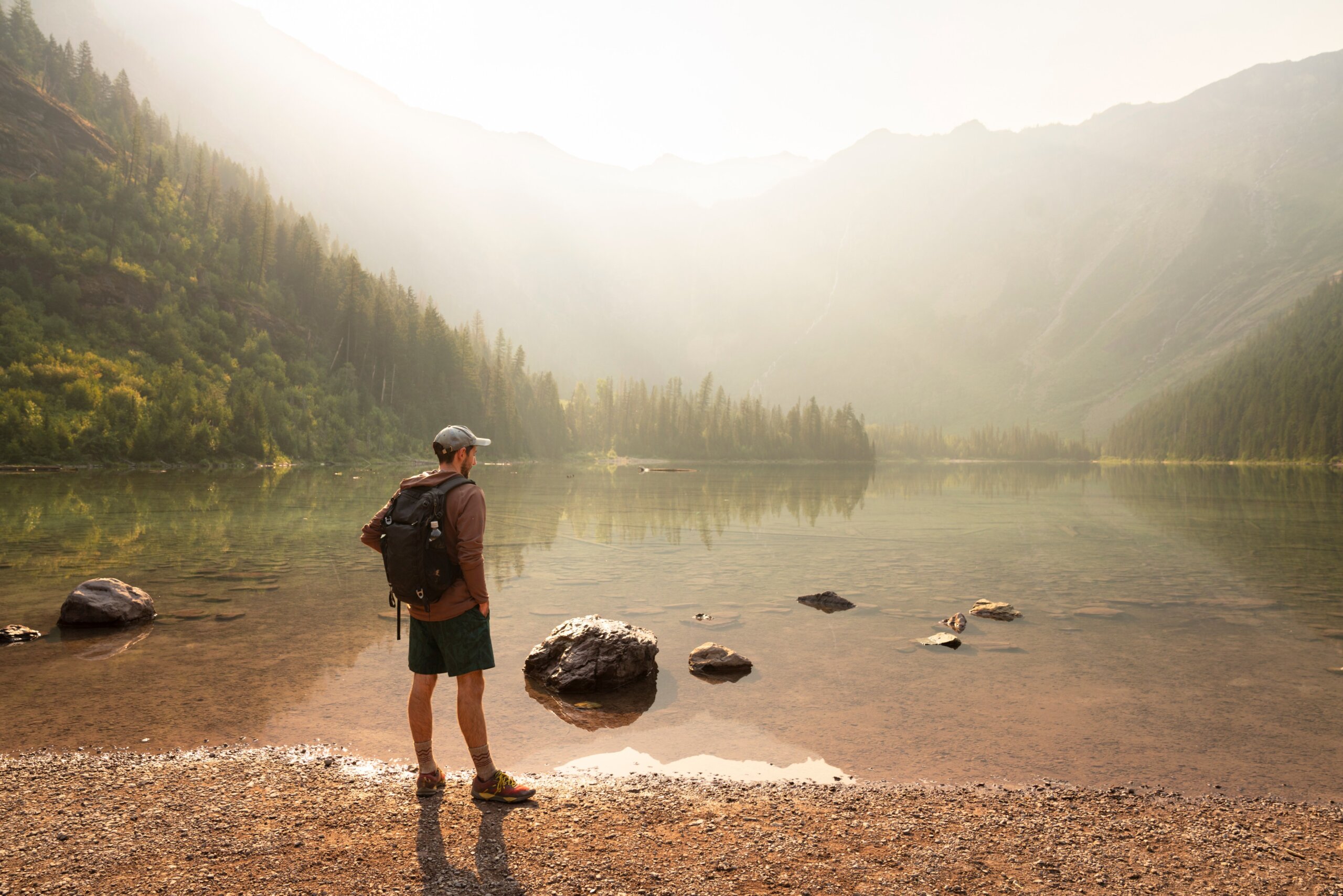 Hiker at Sunrise at Avalanche Lake in Glacier National Park, Montana