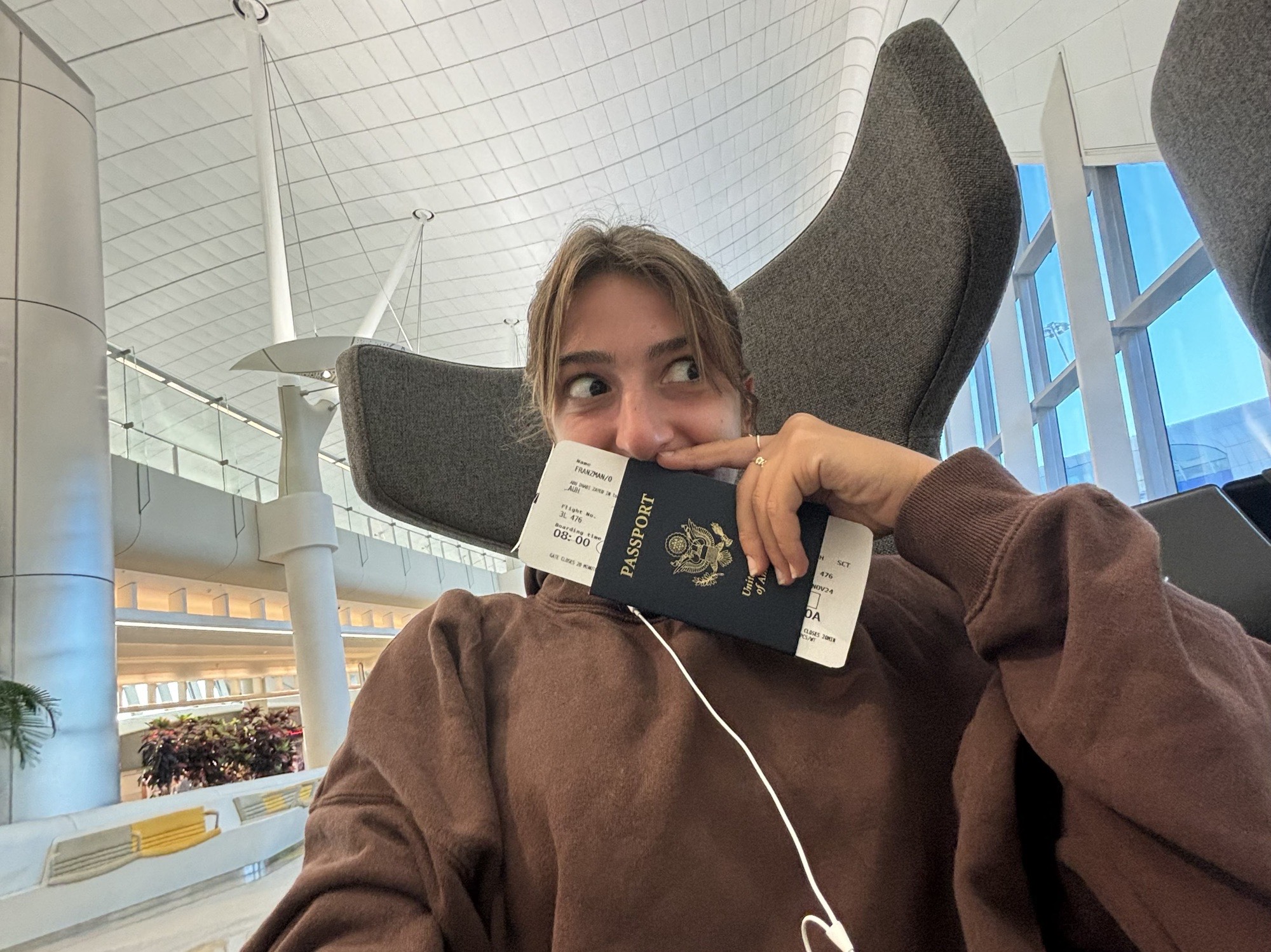 Olivia at the airport with passport