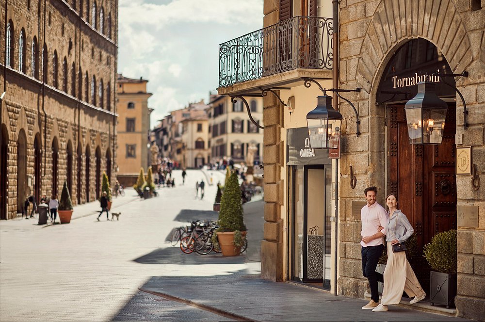 Couple outside Il Tornabuoni luxury boutique hotel in Florence Italy